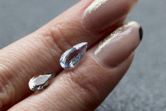 Close up of pear shaped gemstones.
