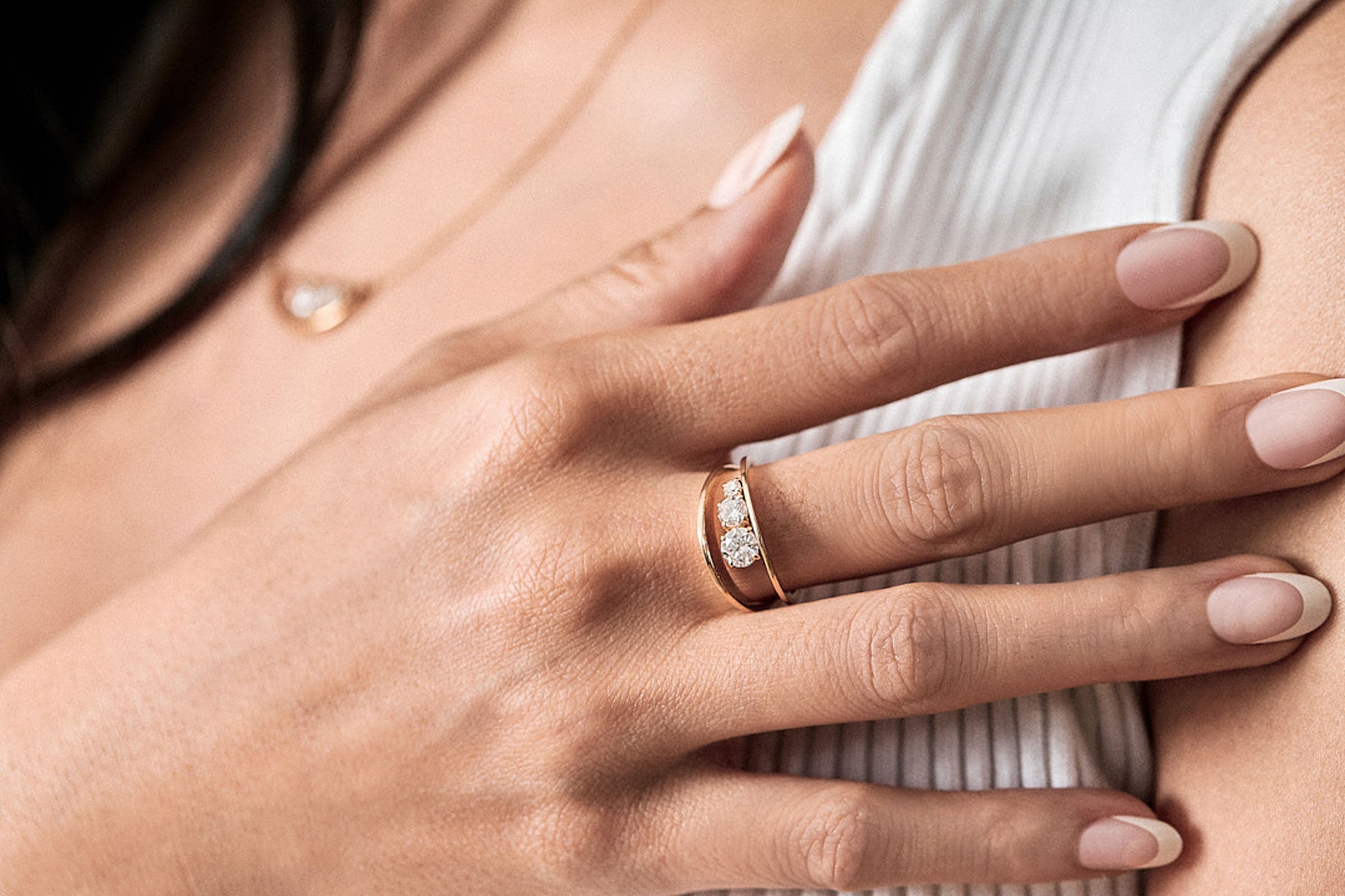Luxury EMPATH Collection showcasing exquisite Empath Earrings, an 18K Gold Necklace, and a stunning one-carat Empath Engagement Ring.