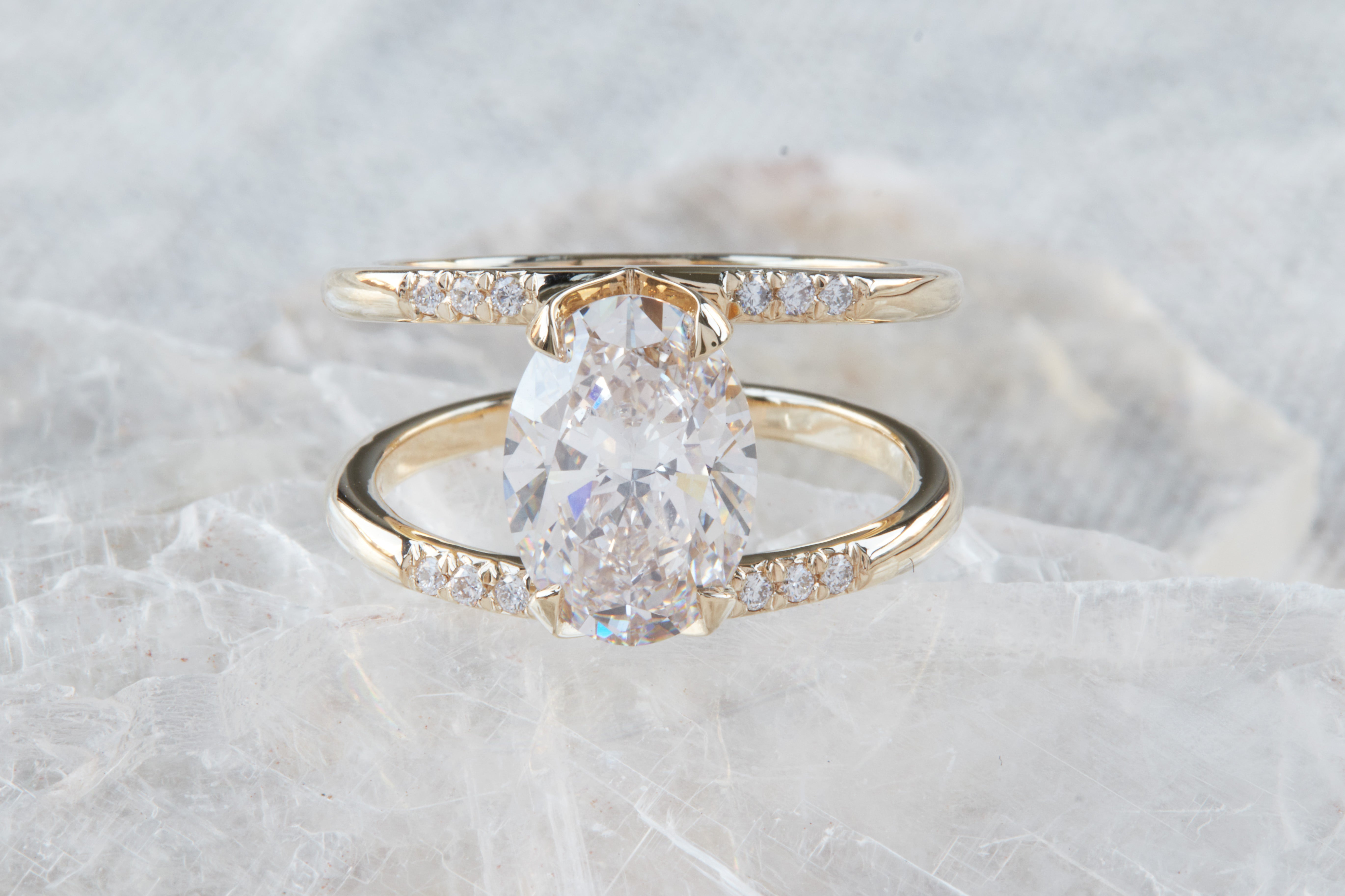 Illuminate Engagement Ring Signature Collection featuring a remarkable oval diamond center stone accented by shimmering diamonds on a graceful band, capturing timeless luxury.