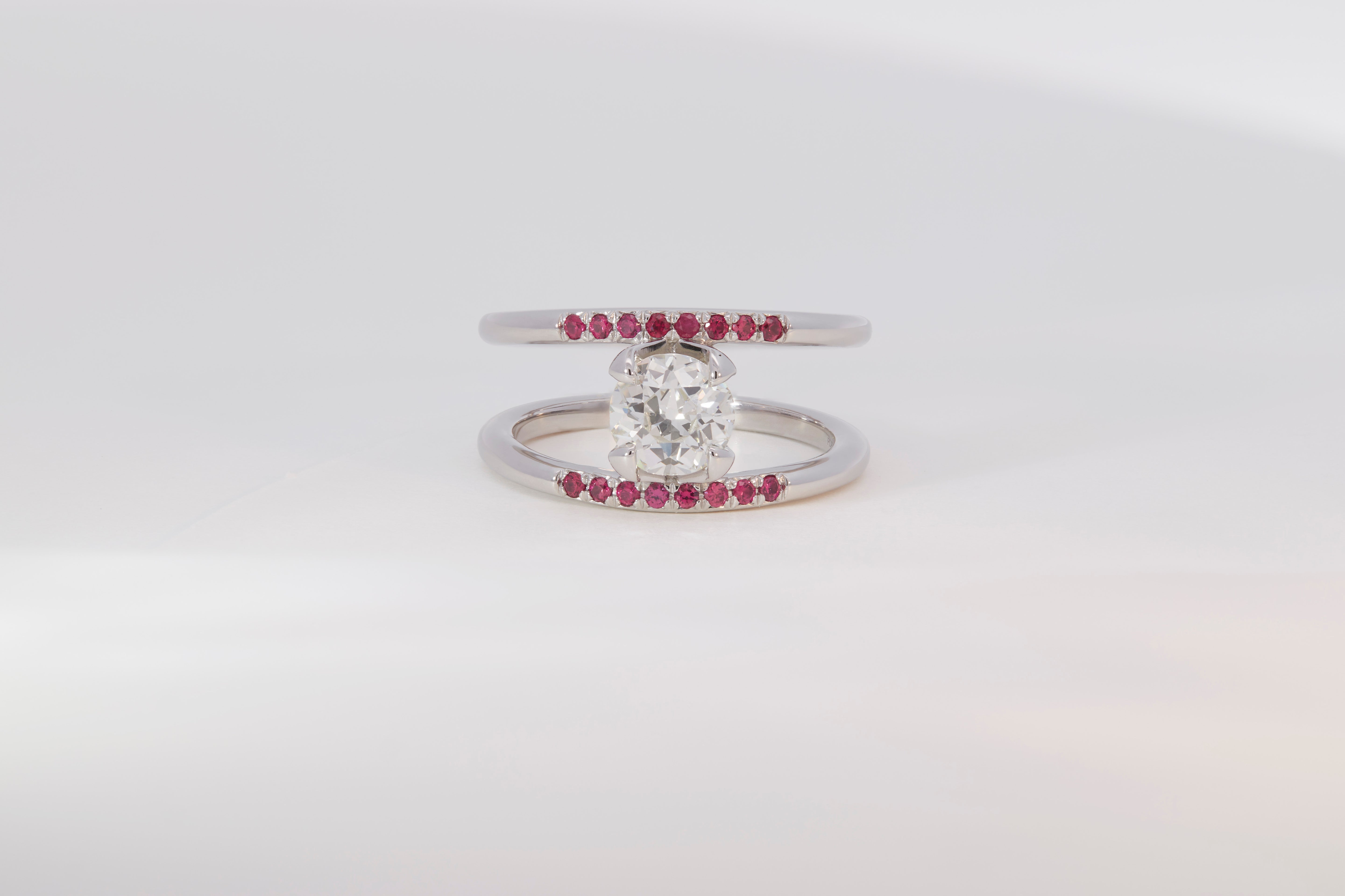 Illuminate Engagement Ring from Signature Collection featuring a sparkling center stone and ruby accents on a sleek band, designed for contemporary elegance.