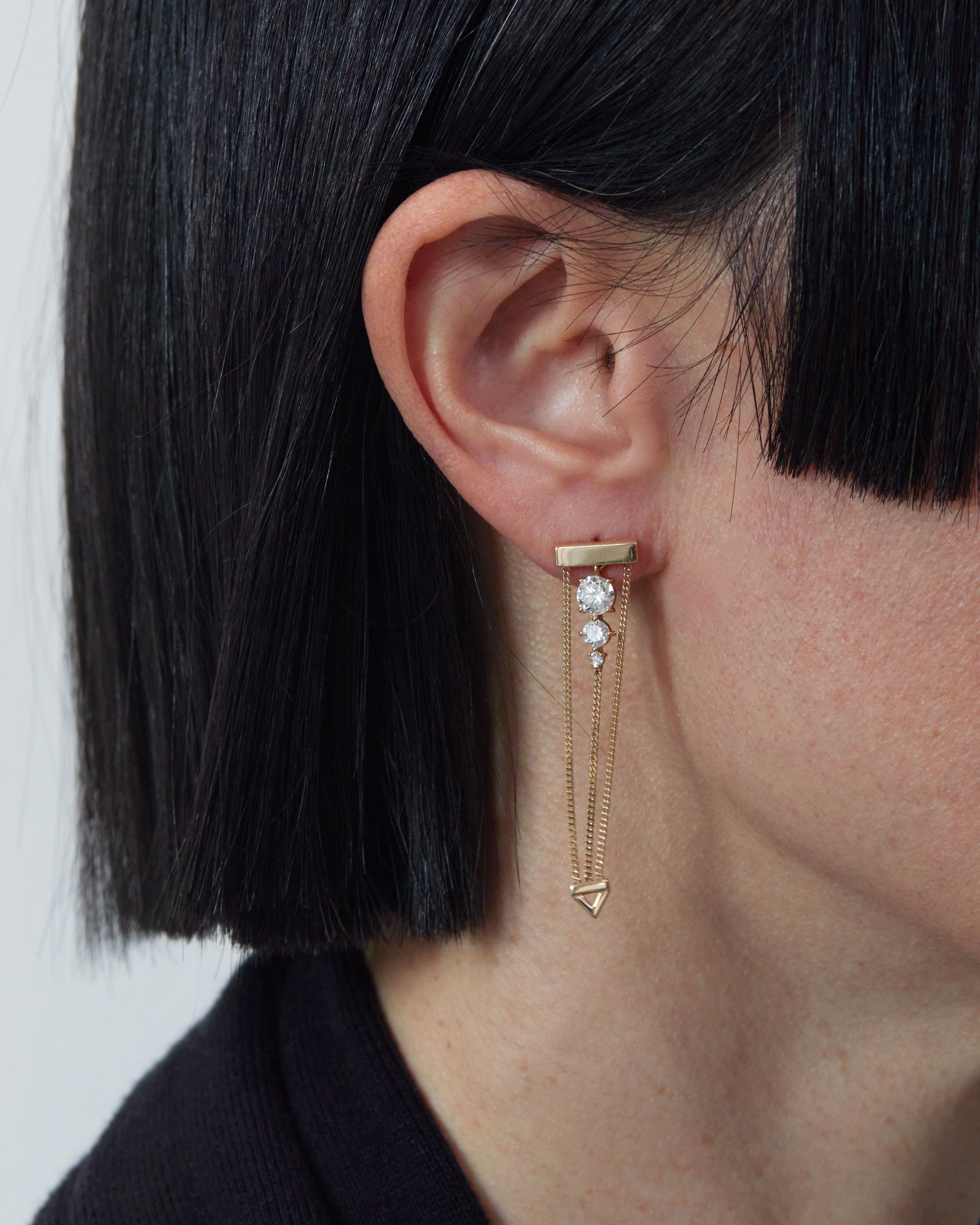 Luxury Levitate Diamond Trio Earrings featuring three certified Lab diamonds showcased on an elegant model, highlighting its unique design inspired by Olafur Eliasson's New York City Waterfalls.