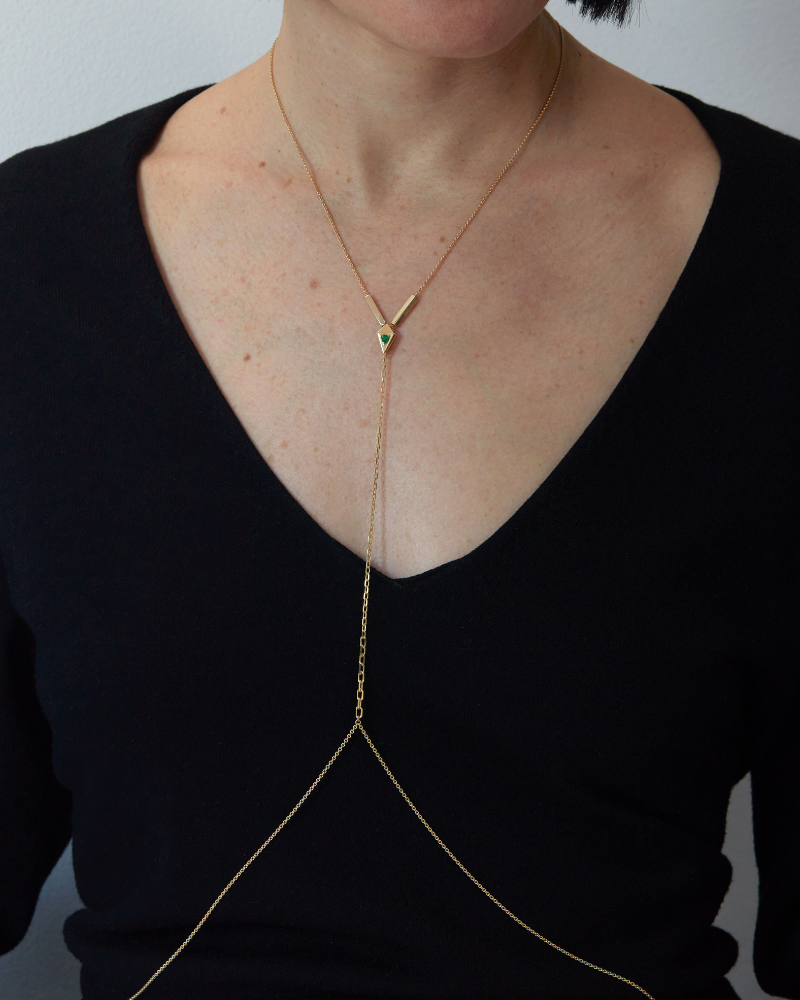Stylish presentation of Open Gold Necklace draped elegantly on a model, showcasing its unique design and luxurious craftsmanship by Bliss Lau.