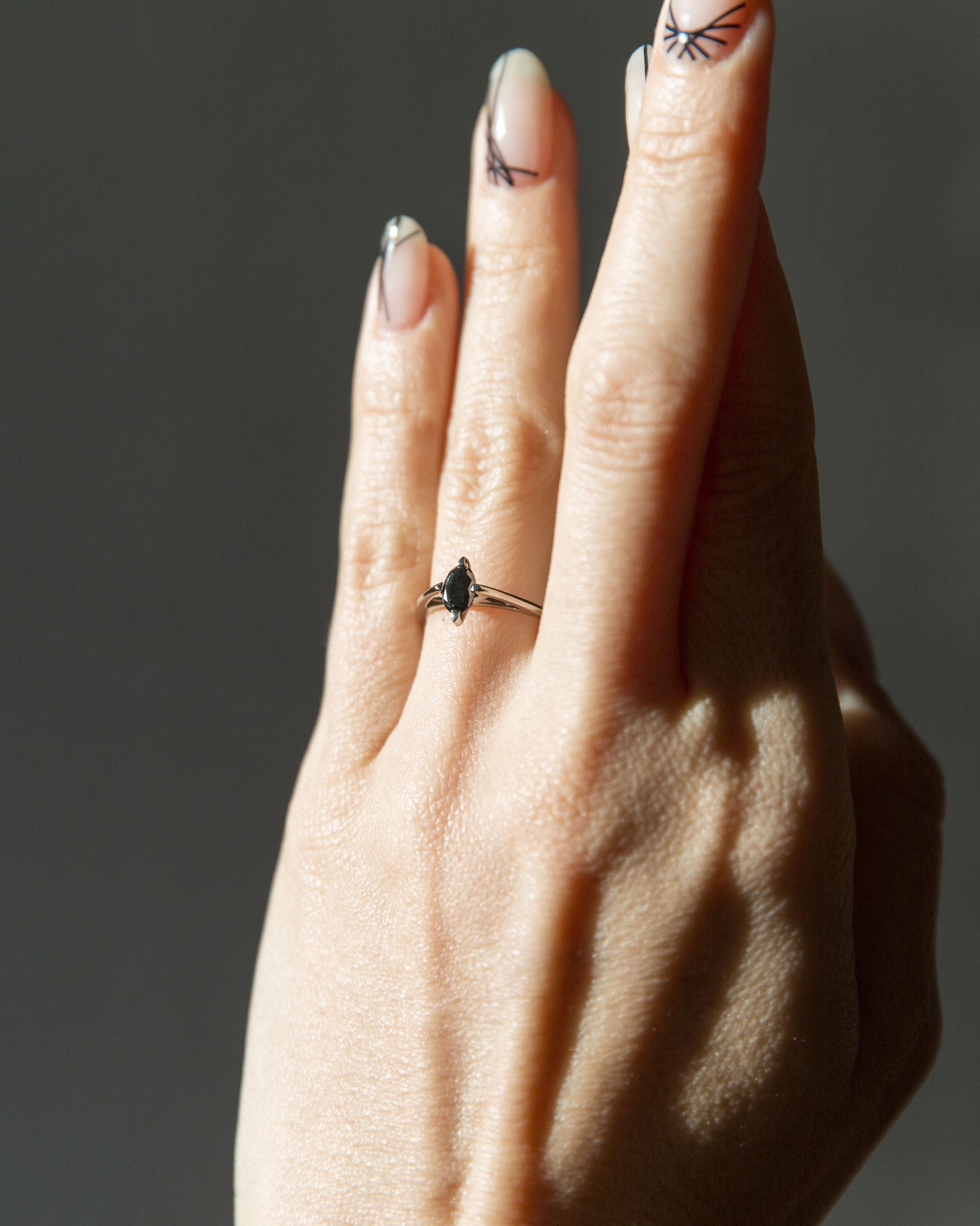A striking minimalist gold ring with a unique design, capturing the essence of Bliss Lau's minimalist arc, minimalist rise, and minimalist pave offerings.