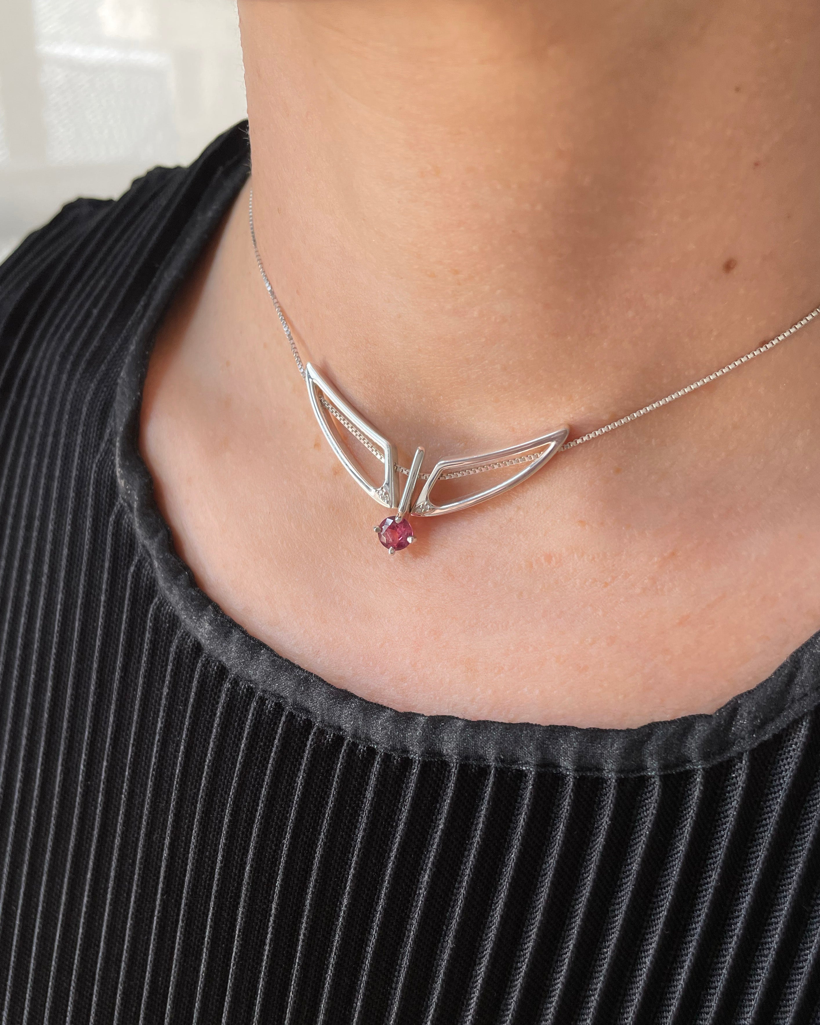 Artistic shot of the Hype Women x Bliss Lau Attune Silver Necklace With Garnet, enhancing its appeal as a premium women’s silver necklace.