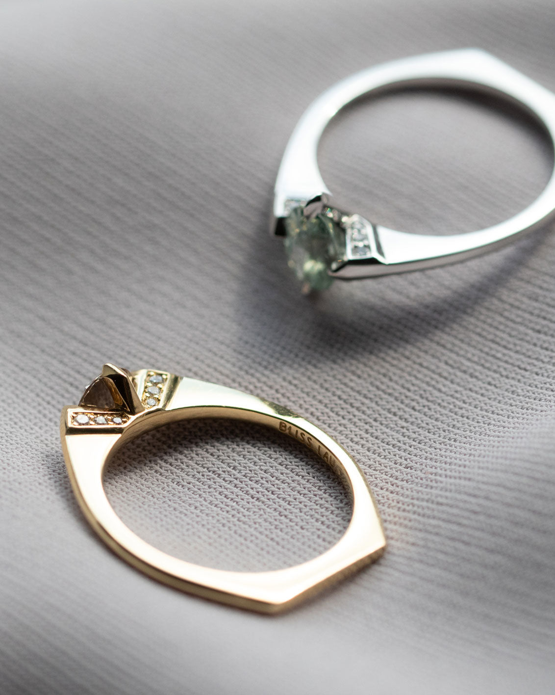 A hand elegantly adorned with a minimalist gold ring, showcasing Bliss Lau's unique perspective on minimalist arc, minimalist rise, and minimalist pave.
