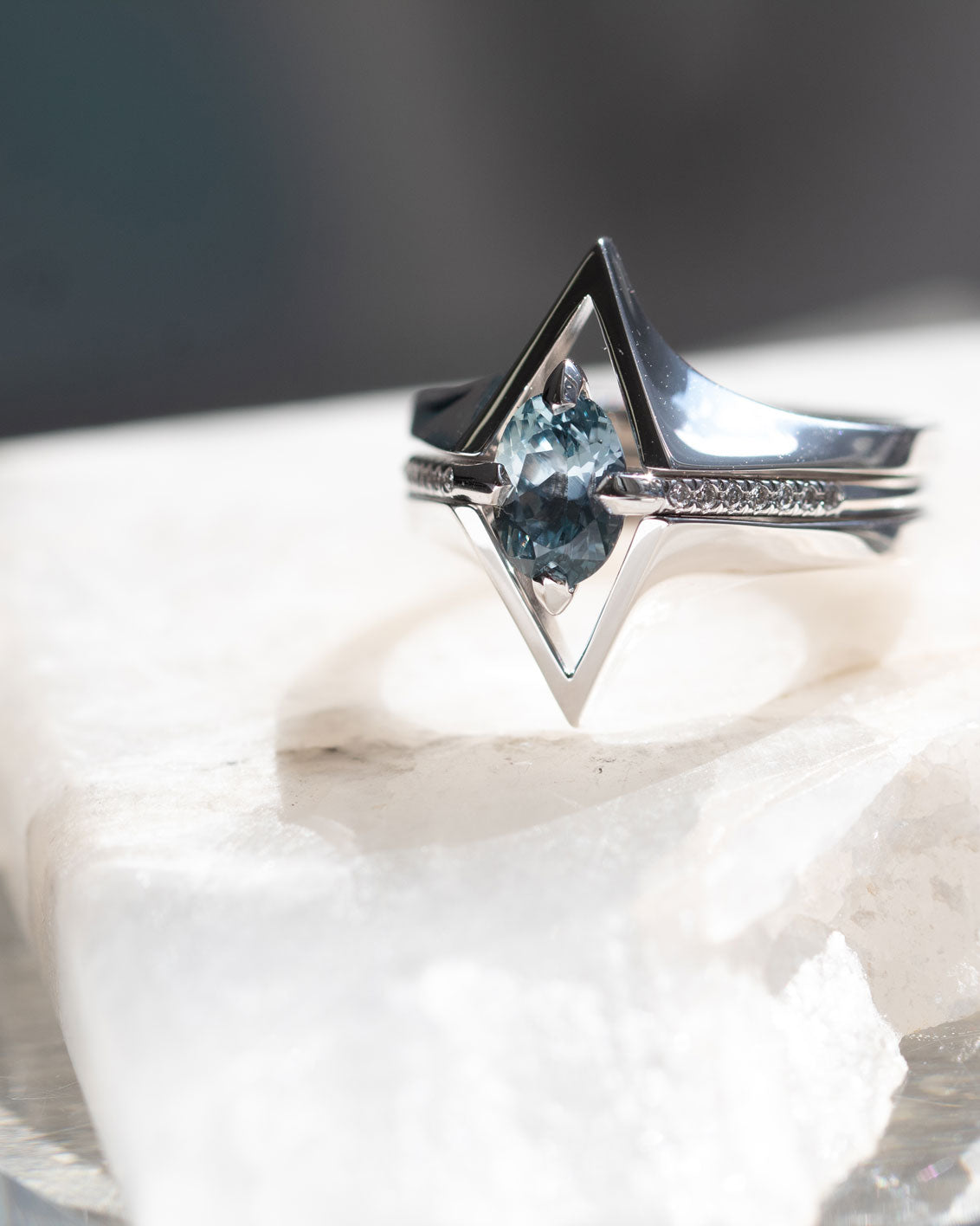 A glamorous minimalist gold ring with a gemstone, demonstrating Bliss Lau's approach to minimalist arc, minimalist rise, and minimalist pave.