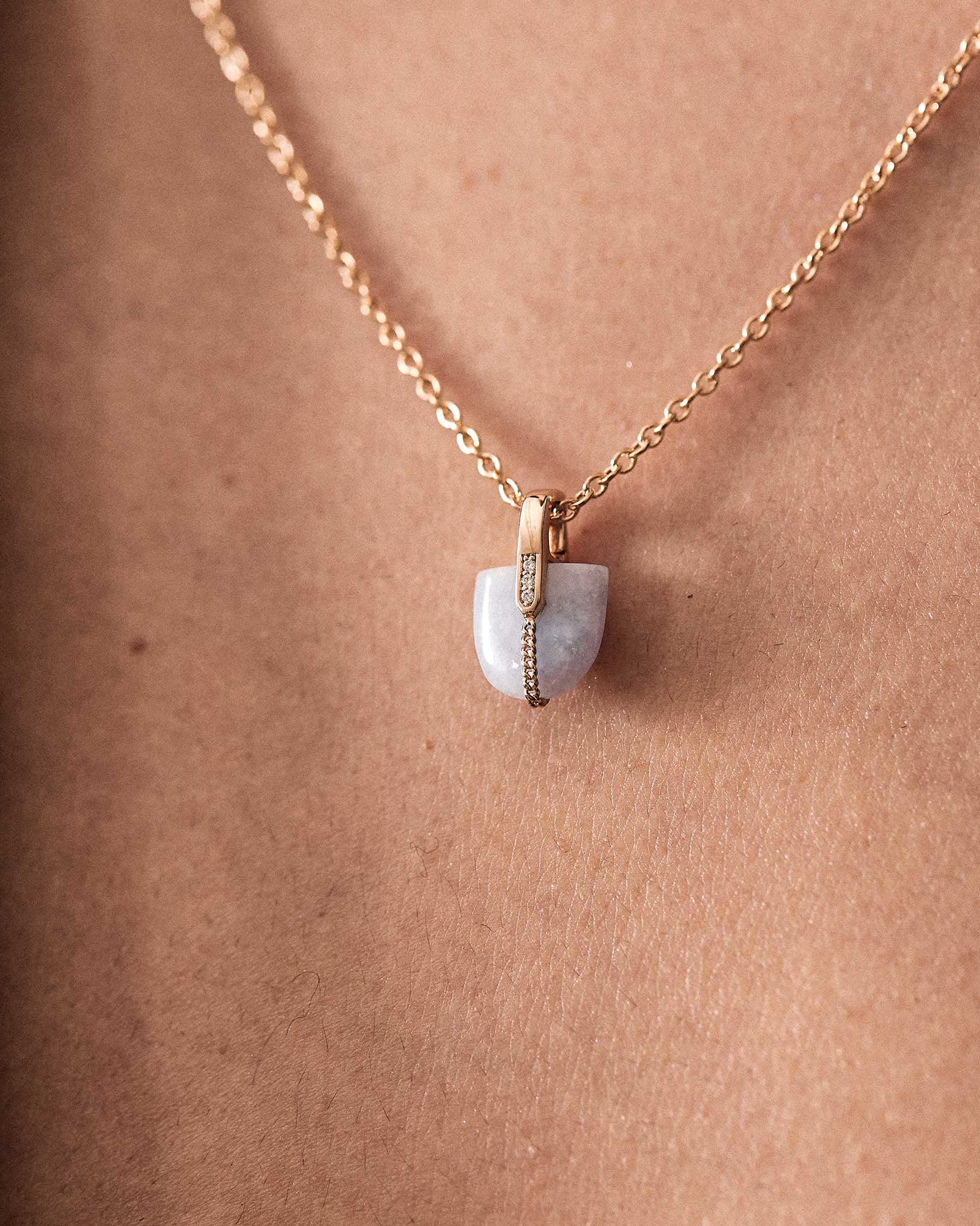 Close-up of the Lavender Jade Pendant by Bliss Lau, emphasizing the soothing lavender hue and stylish gold elements.