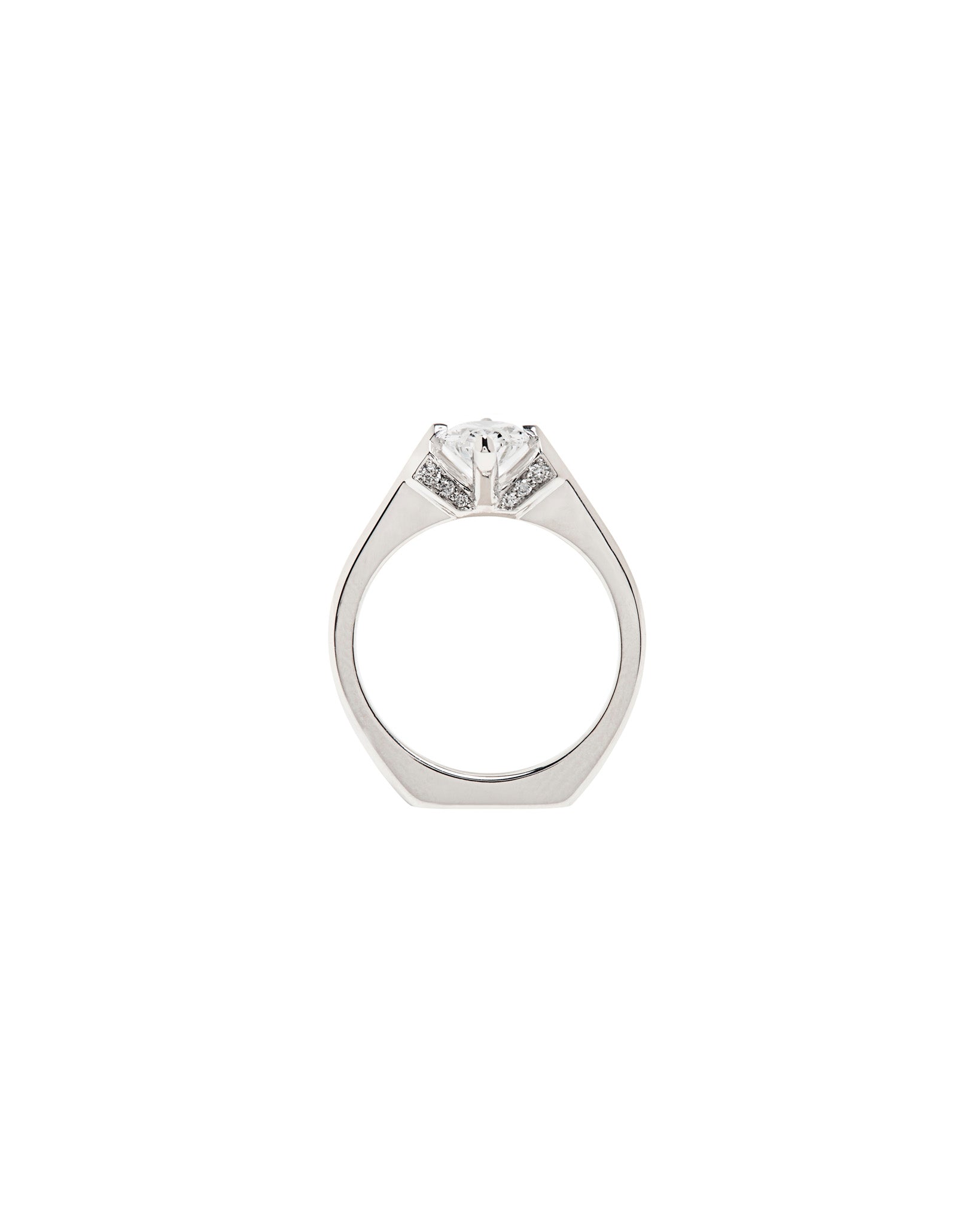 An enchanting minimalist gold ring displayed on a textured surface, highlighting the artisanal craft of Bliss Lau featuring minimalist arc, minimalist rise, and minimalist pave designs.