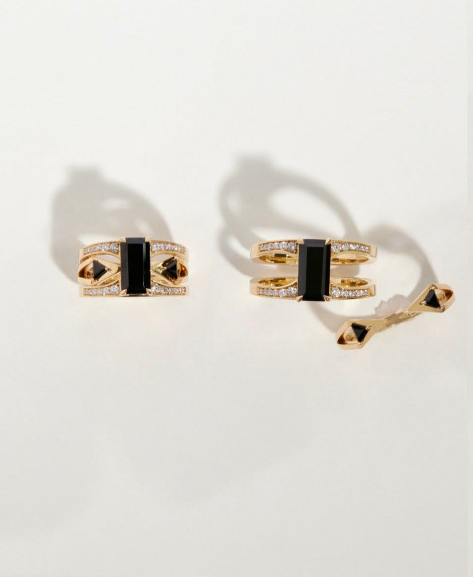 Artistic arrangement of the Mirage + Reflection Ring Set by Bliss Lau, displaying the beautiful design of black spinel and gold rings.