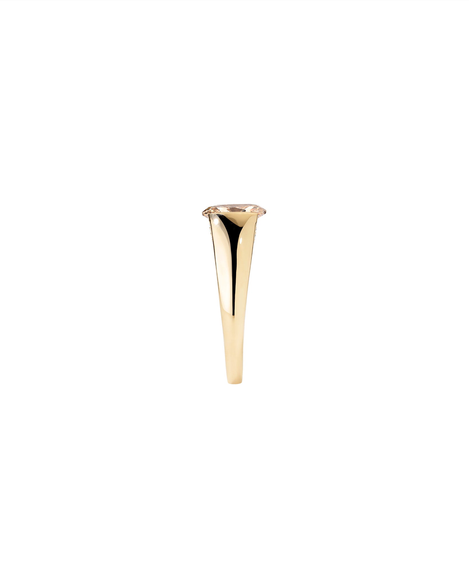 Side view of a gold ring with a champagne diamond on a white background