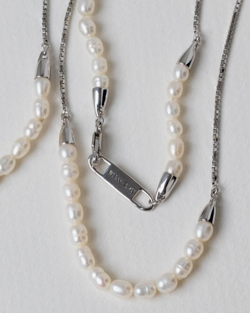Bliss Lau pearl and sterling silver Meridian necklace with silver clasp on a light gray background
