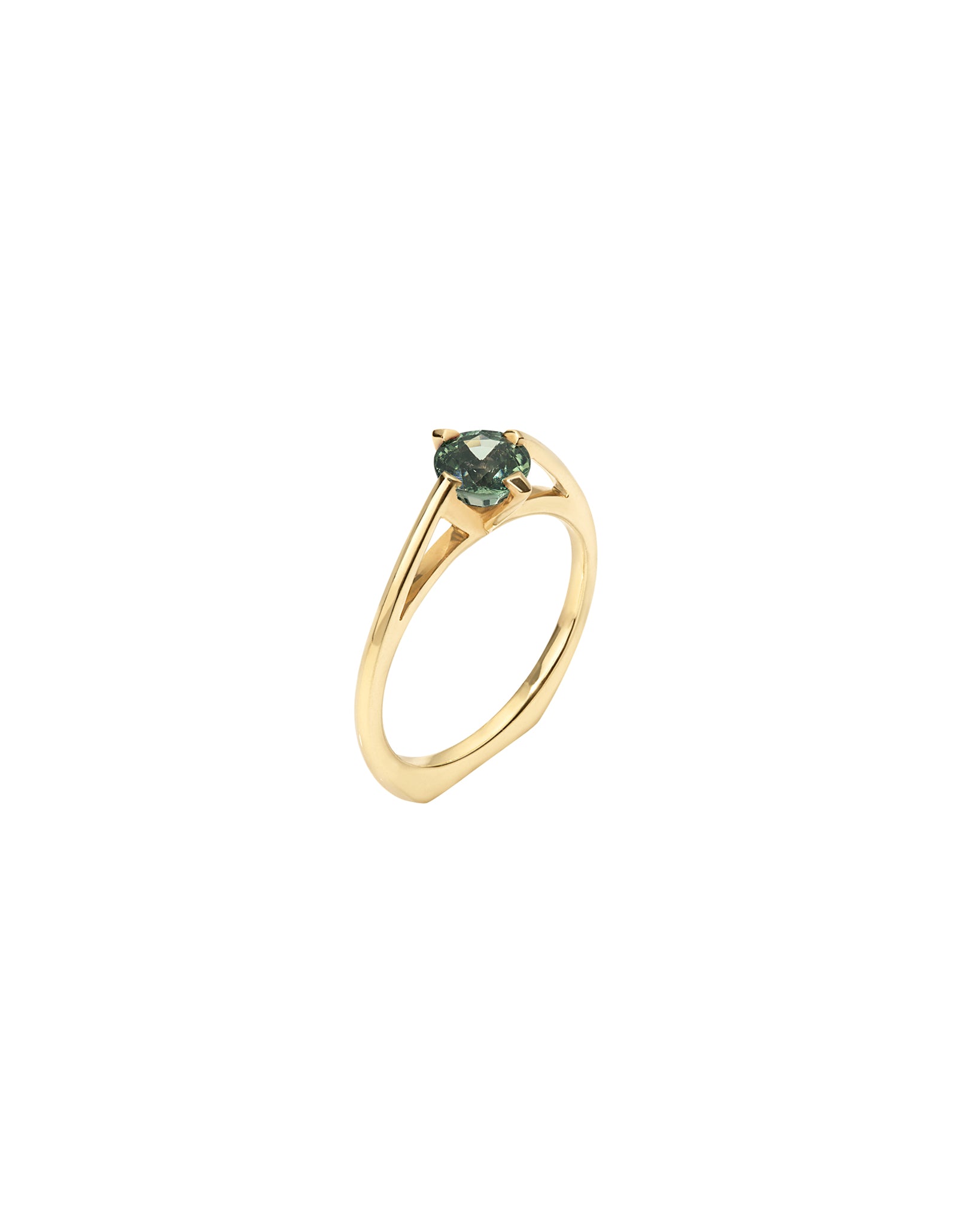 Gold ring with a green gemstone on a white background