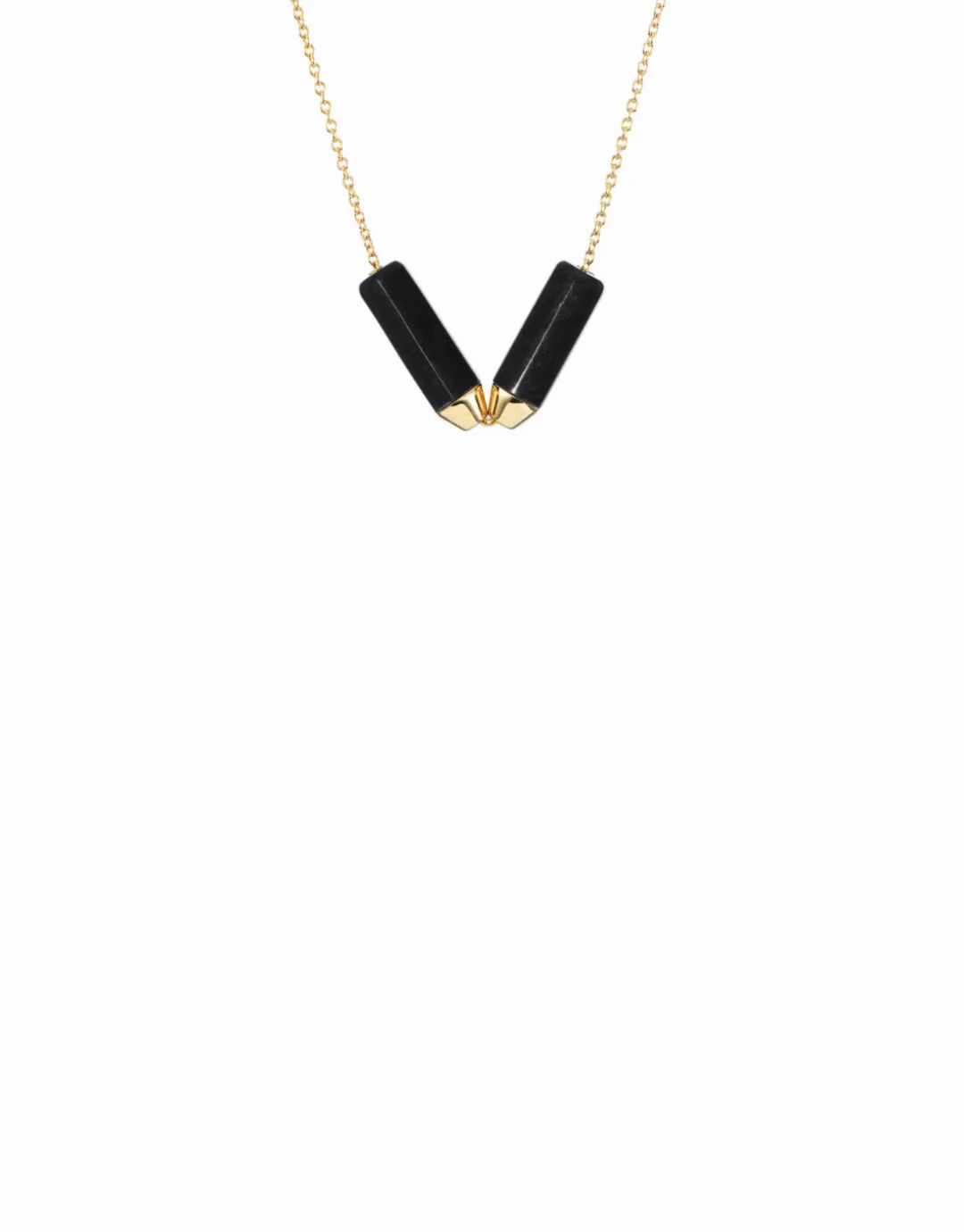 The stunning Open Necklace + Vantage Curio Black Jade Set displayed elegantly, featuring two sculptural beams of black jade paired with luxurious 18k yellow gold accents.