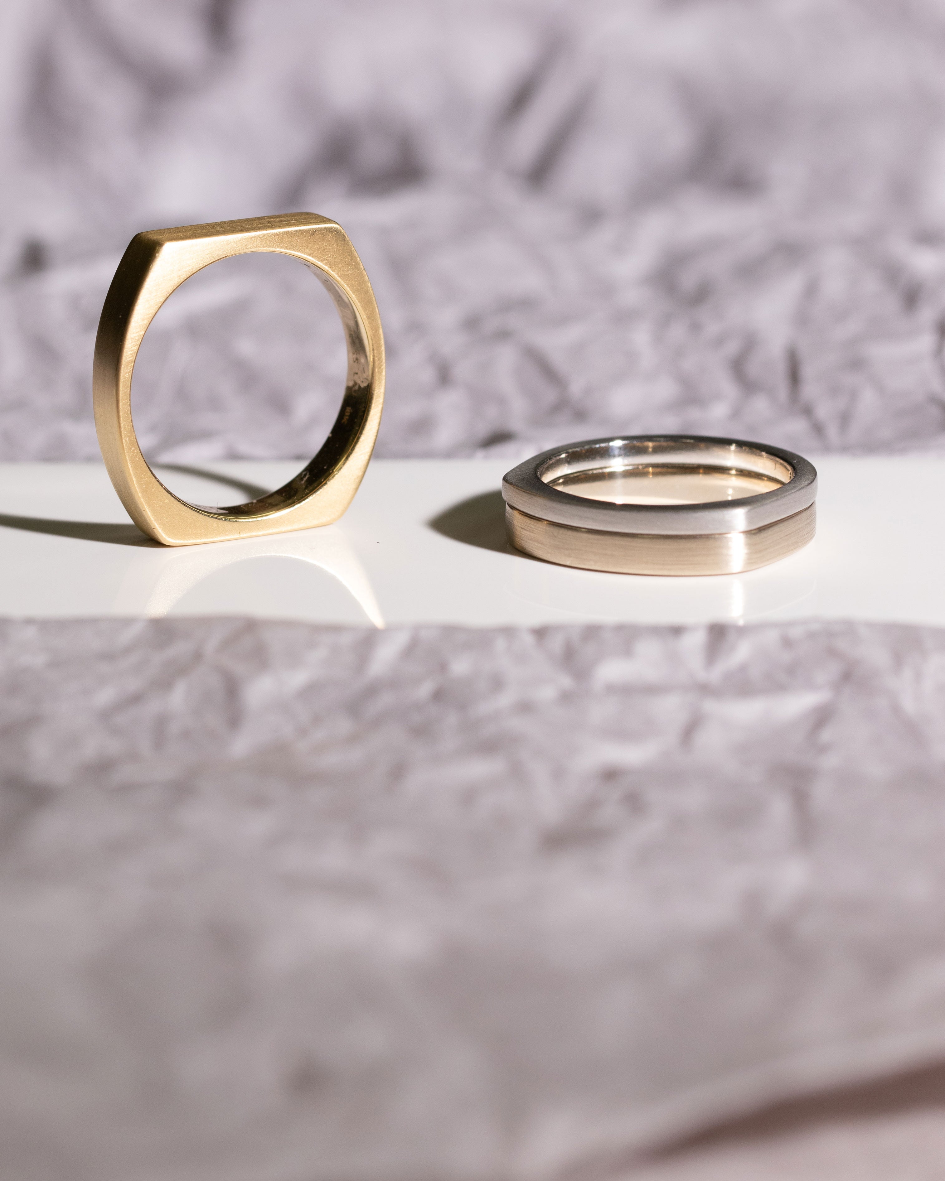 Multiple Men's Custom Bands Different tones of gold.