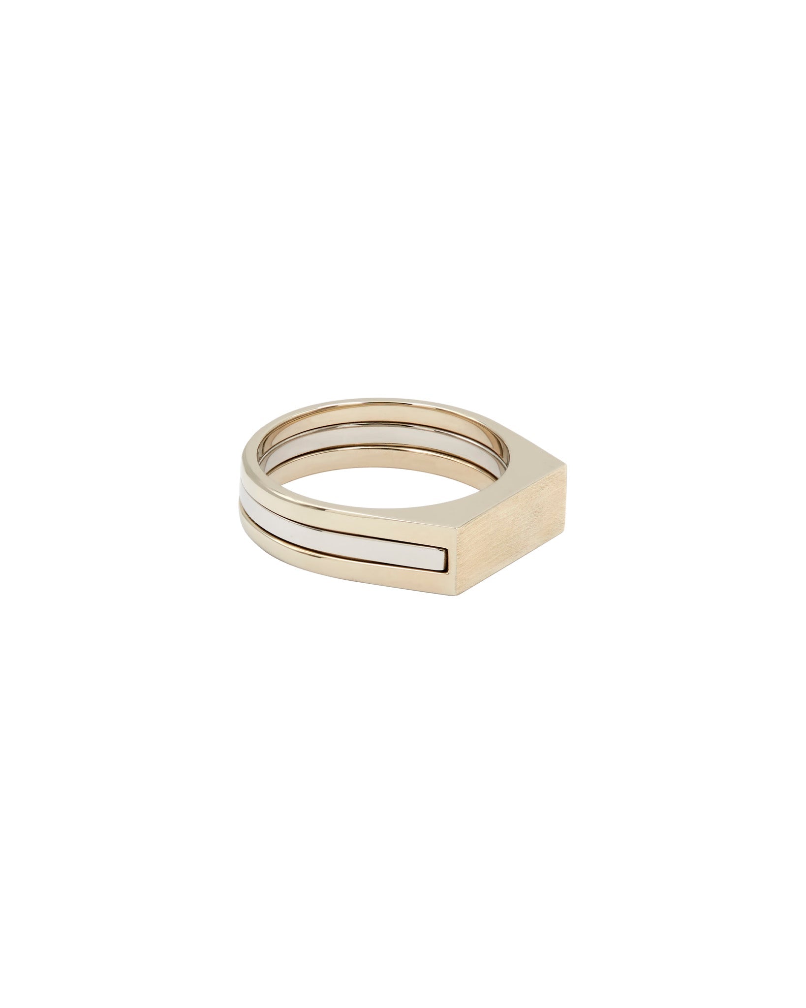 Cohesive Ring Set displayed with a focus on the natural white gold interlocking ring that showcases a modern signet design, representing customizable elegance.
