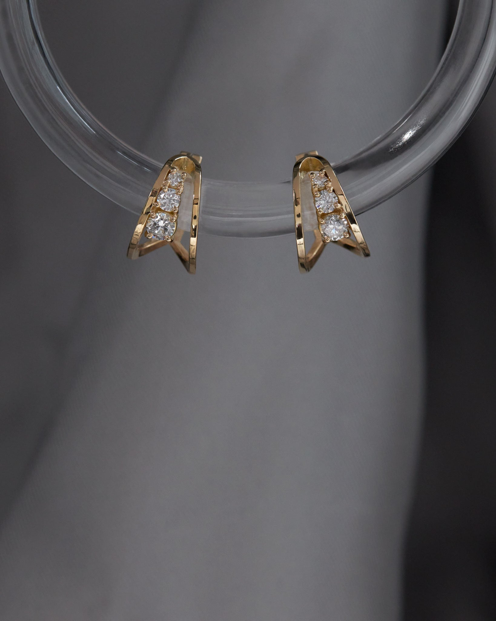 lifestyle image of empath earrings in lab diamond and 18k gold
