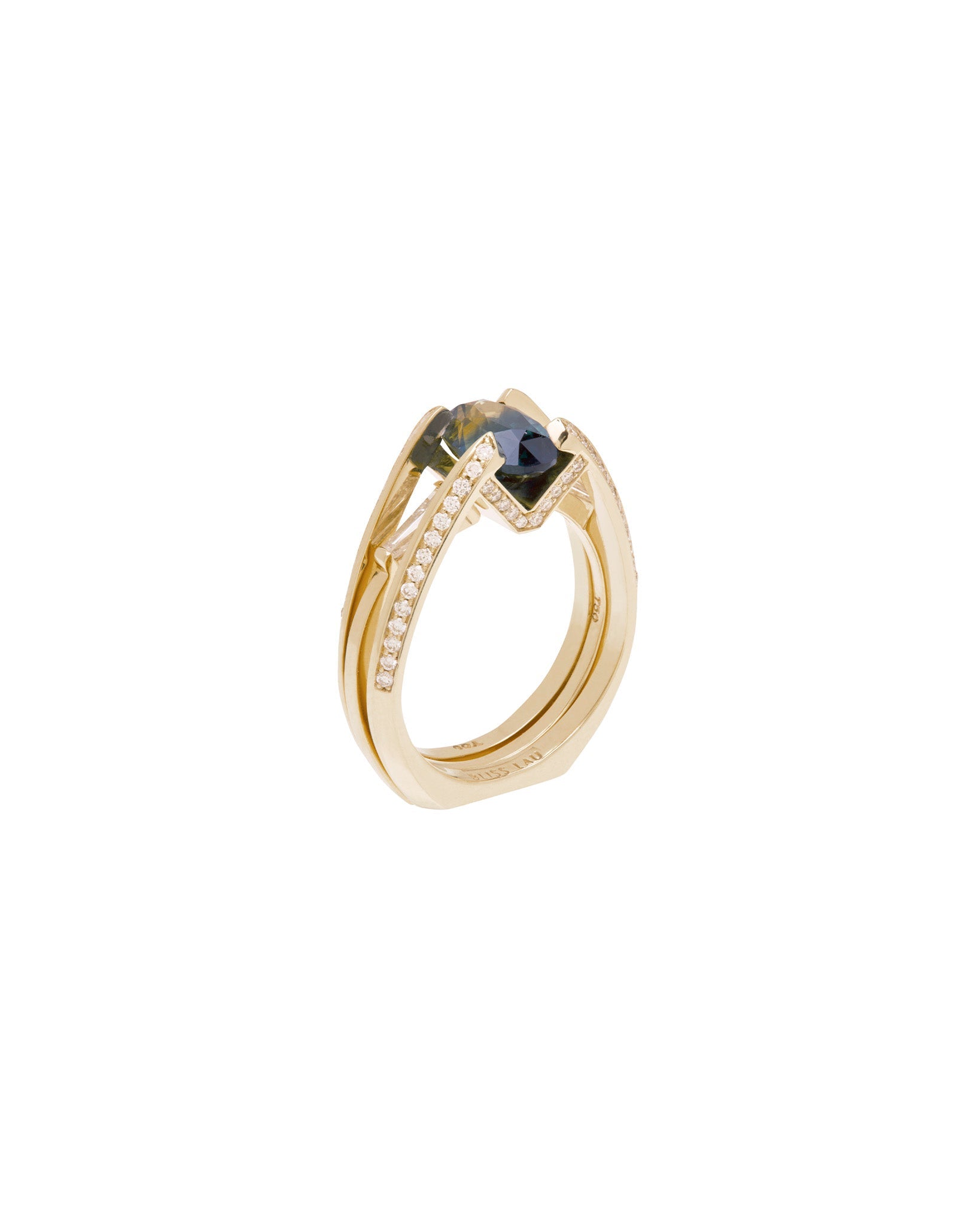 Futurist Engagement Ring Signature Collection showcasing a luxurious gold ring with a striking blue gemstone and detailed diamond embellishments, perfectly crafted for a modern woman.