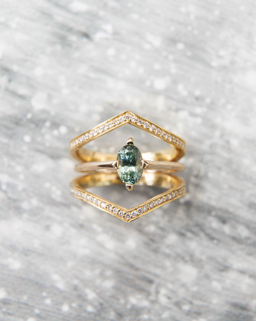 Minimalist arc engagement ring with interlocking wedding band