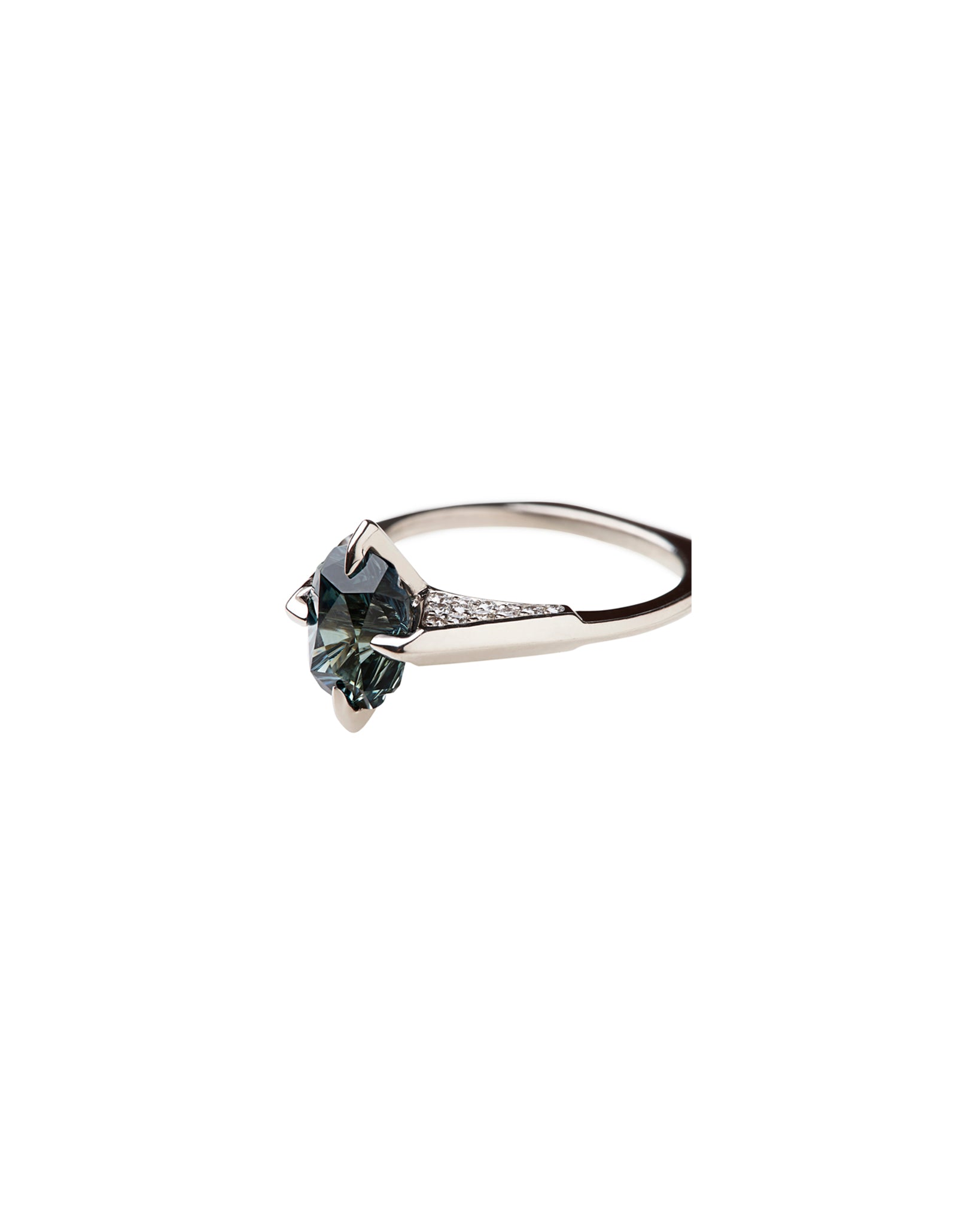 Close-up shot of the Minimalist Ring Sapphire with intricate diamond detail alongside the mesmerizing blue green sapphire, emphasizing luxurious craftsmanship.