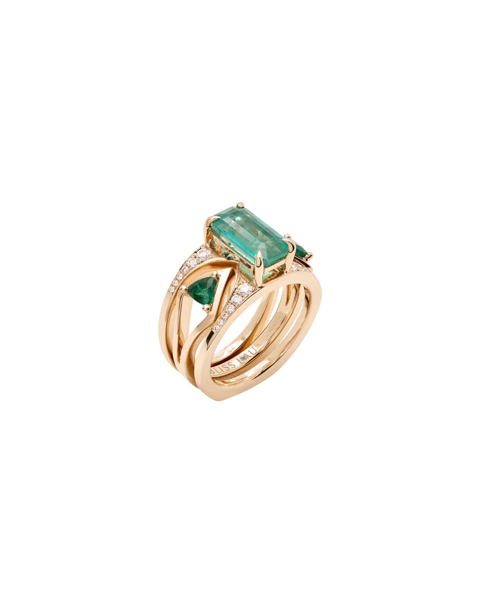 Close-up of the Mirage + Reflection Ring Set Emerald showcasing the handcrafted design with a vibrant emerald centerpiece and sparkling diamonds.
