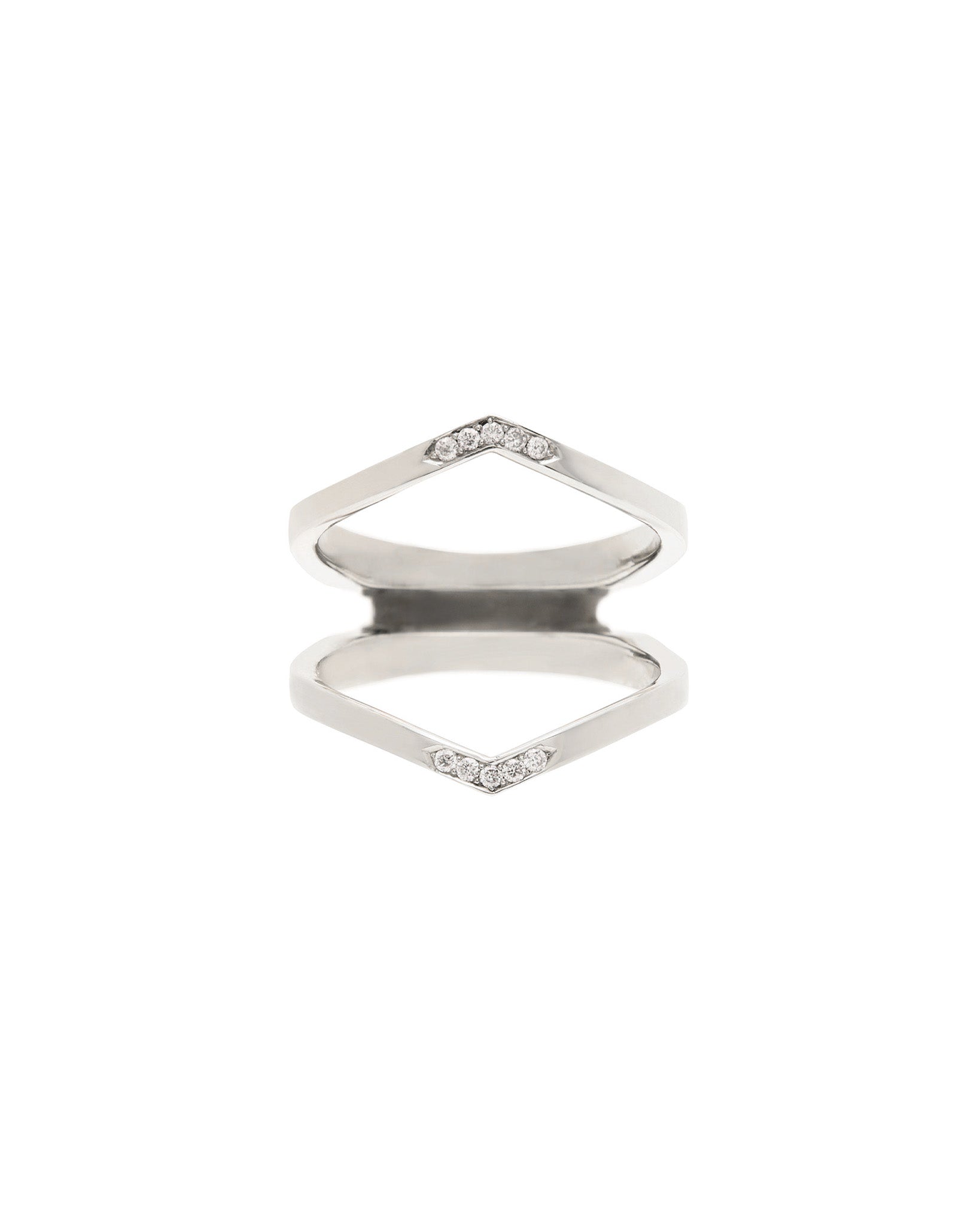 A stunning white gold Oblique X Enclose Band showcased against a minimalist background, showcasing its elegant shape and diamond detailing.