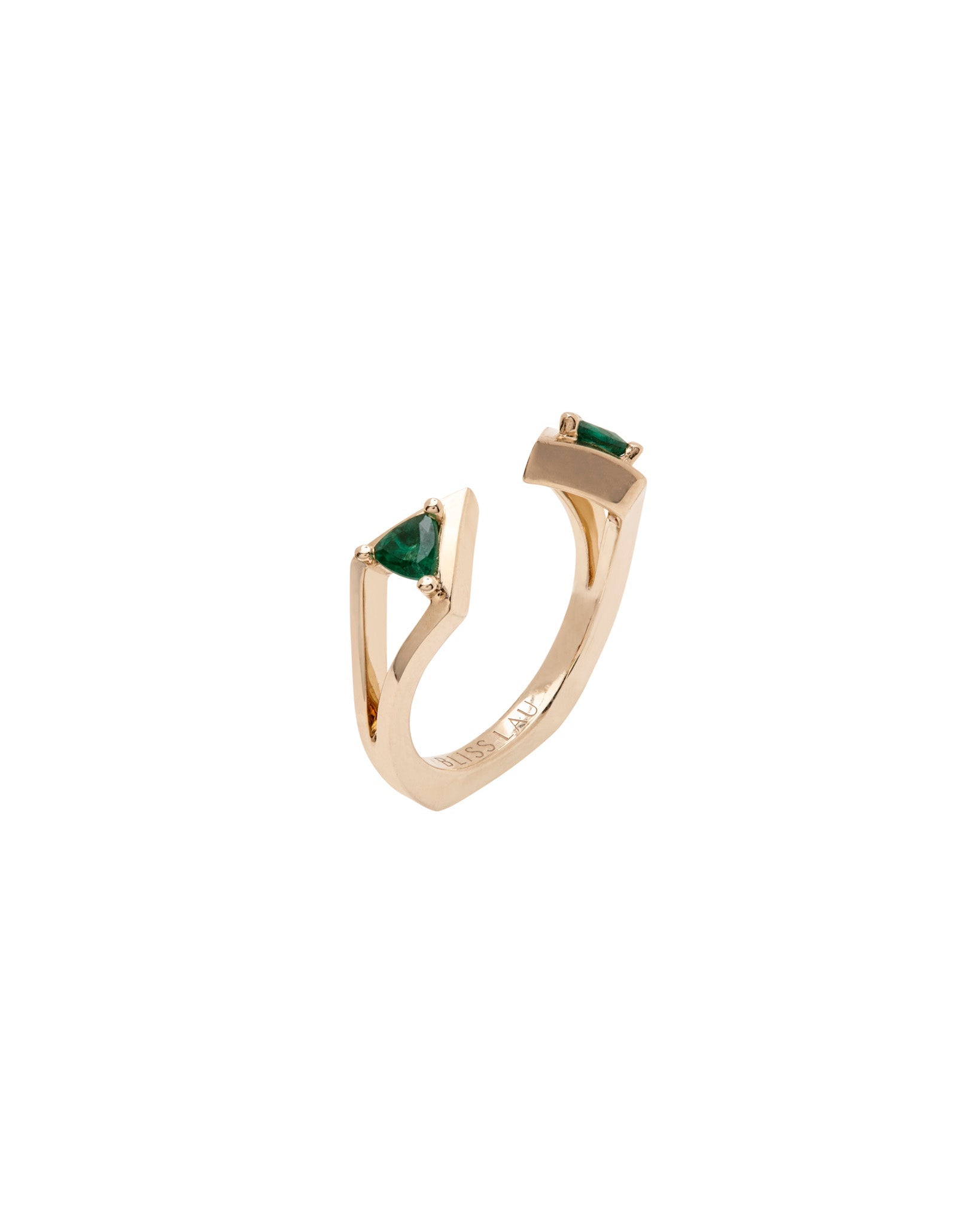 Stylish Reflection Band in yellow gold, designed with two vibrant emerald trillion gemstones, offering a unique silhouette that emphasizes contemporary luxury.