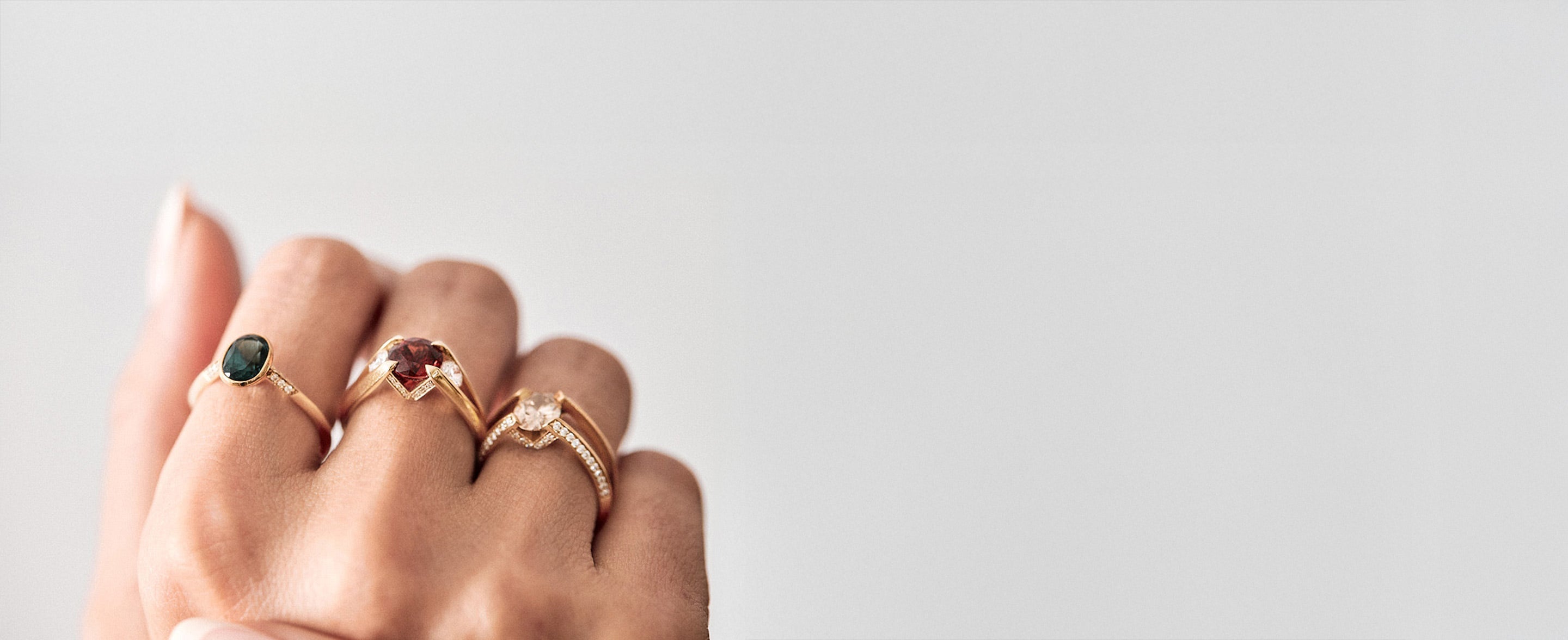 Engagement ring featuring a stunning yellow gold design, elegantly showcasing a central diamond surrounded by smaller stones, perfect for symbolizing unique love in the ENGAGEMENT RINGS collection.