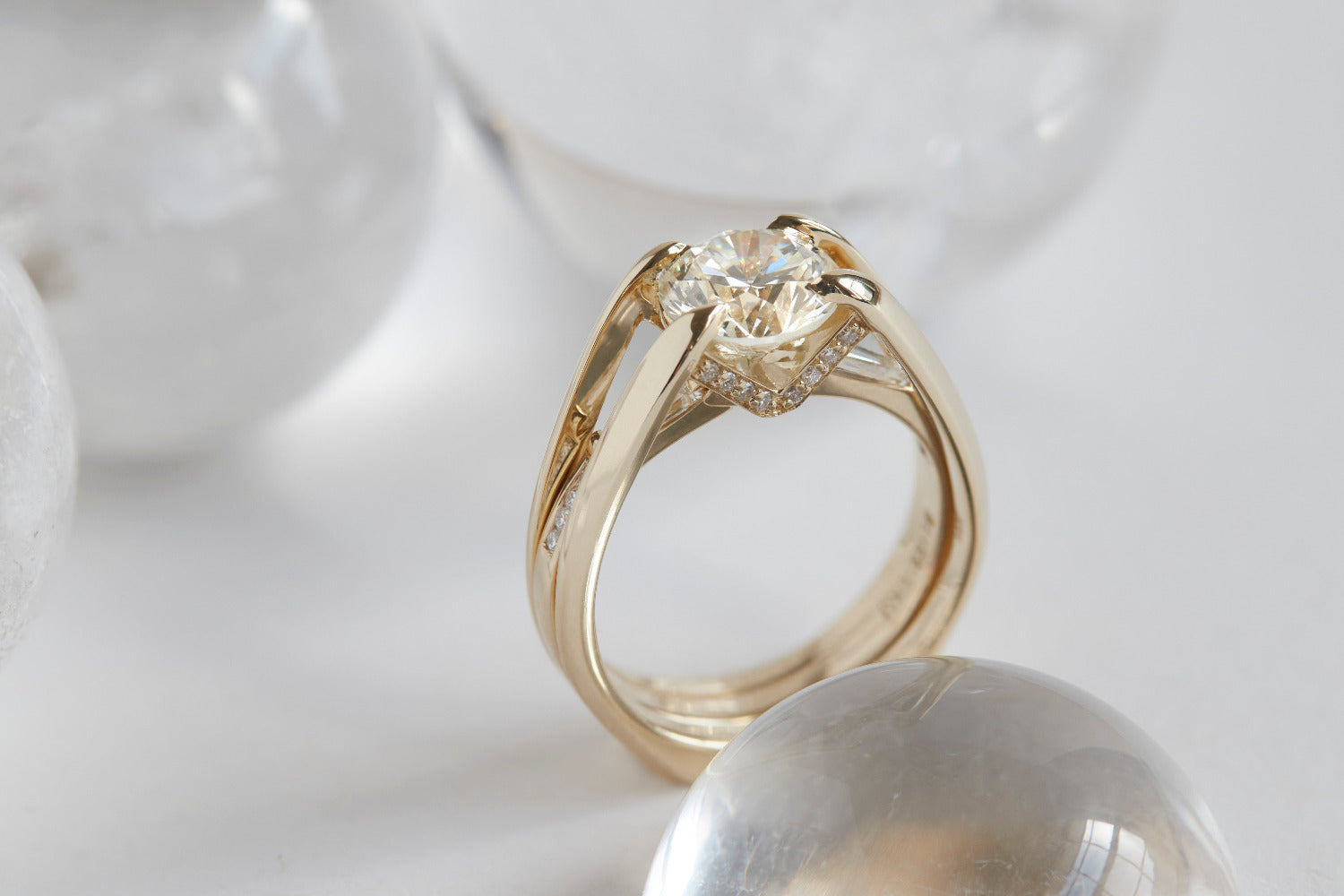 Engagement ring featuring a stunning yellow gold design, elegantly showcasing a central diamond surrounded by smaller stones, perfect for symbolizing unique love in the ENGAGEMENT RINGS collection.