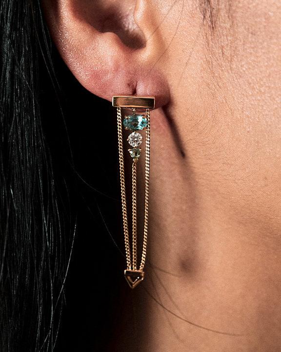 Close up of woman's ear wearing the Bliss Lau levitate earrings with graduating tourmaline. 