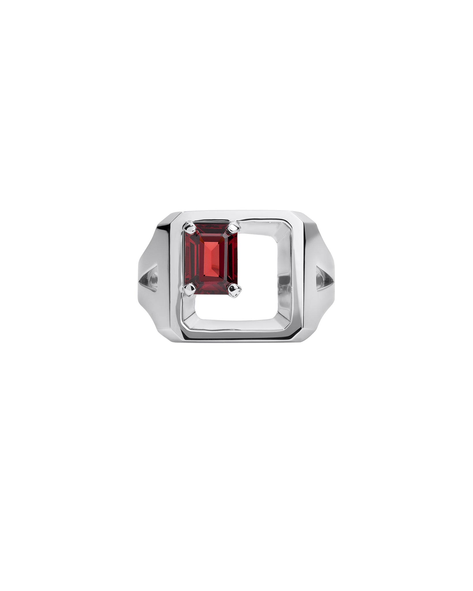 Silver signet ring with a red garnet gemstone on a white background