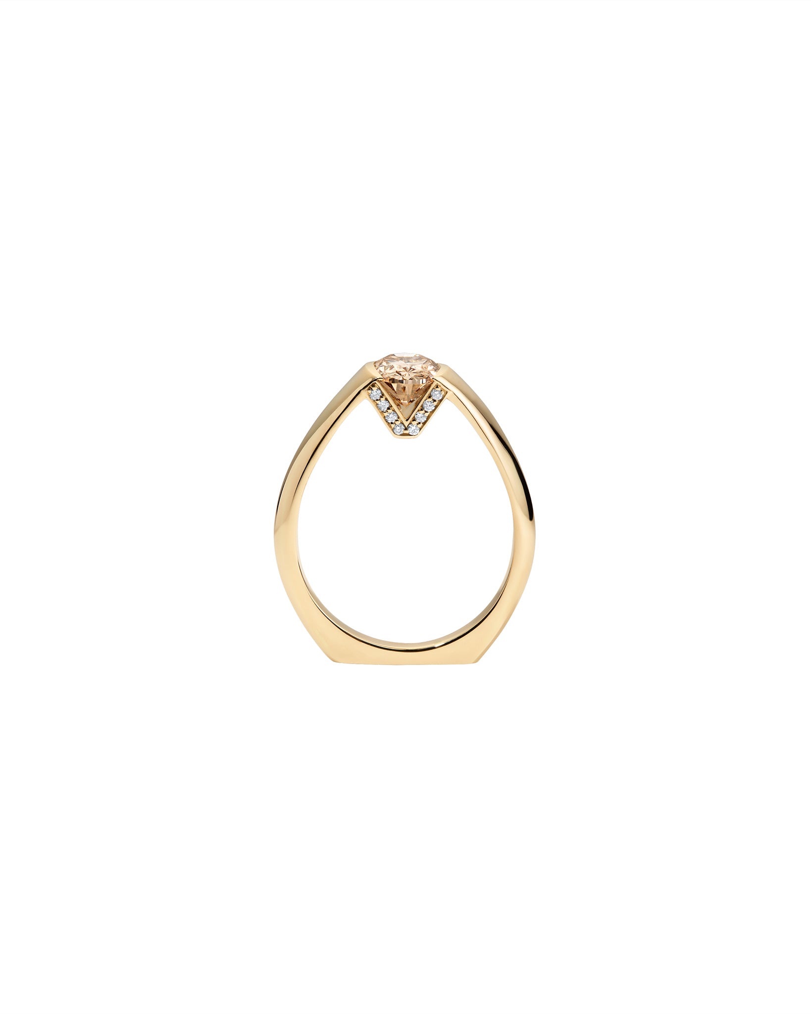 Gold ring with a Champagne diamond on a white background
