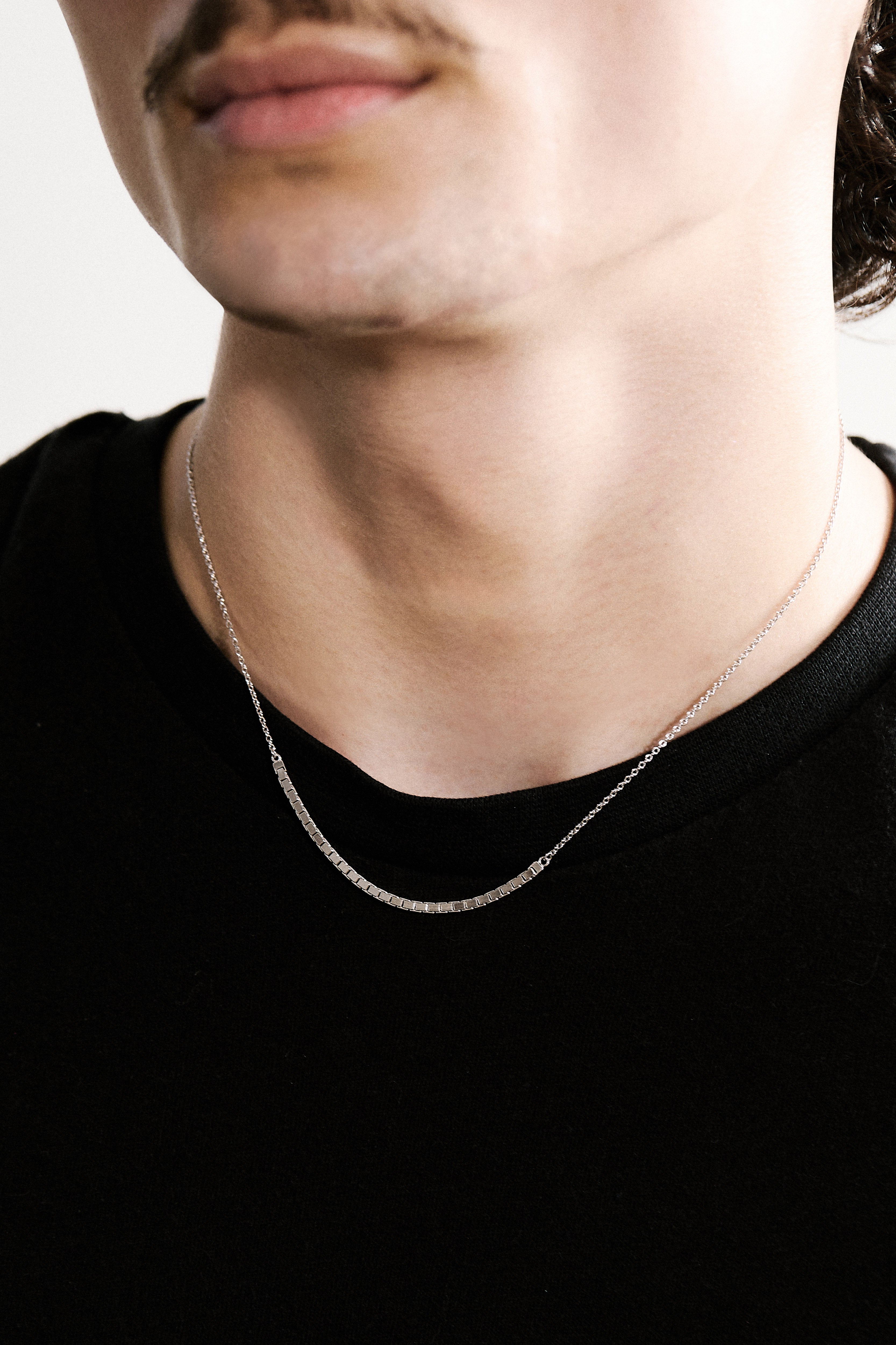 Sterling silver necklace on a man's neck 