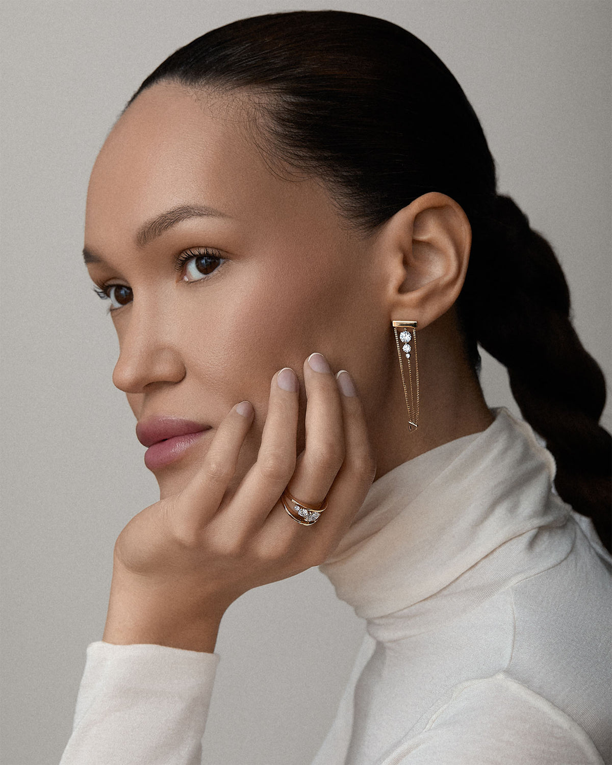 woman wearing Bliss Lau Levitate diamond earrings and Empath Diamond ring