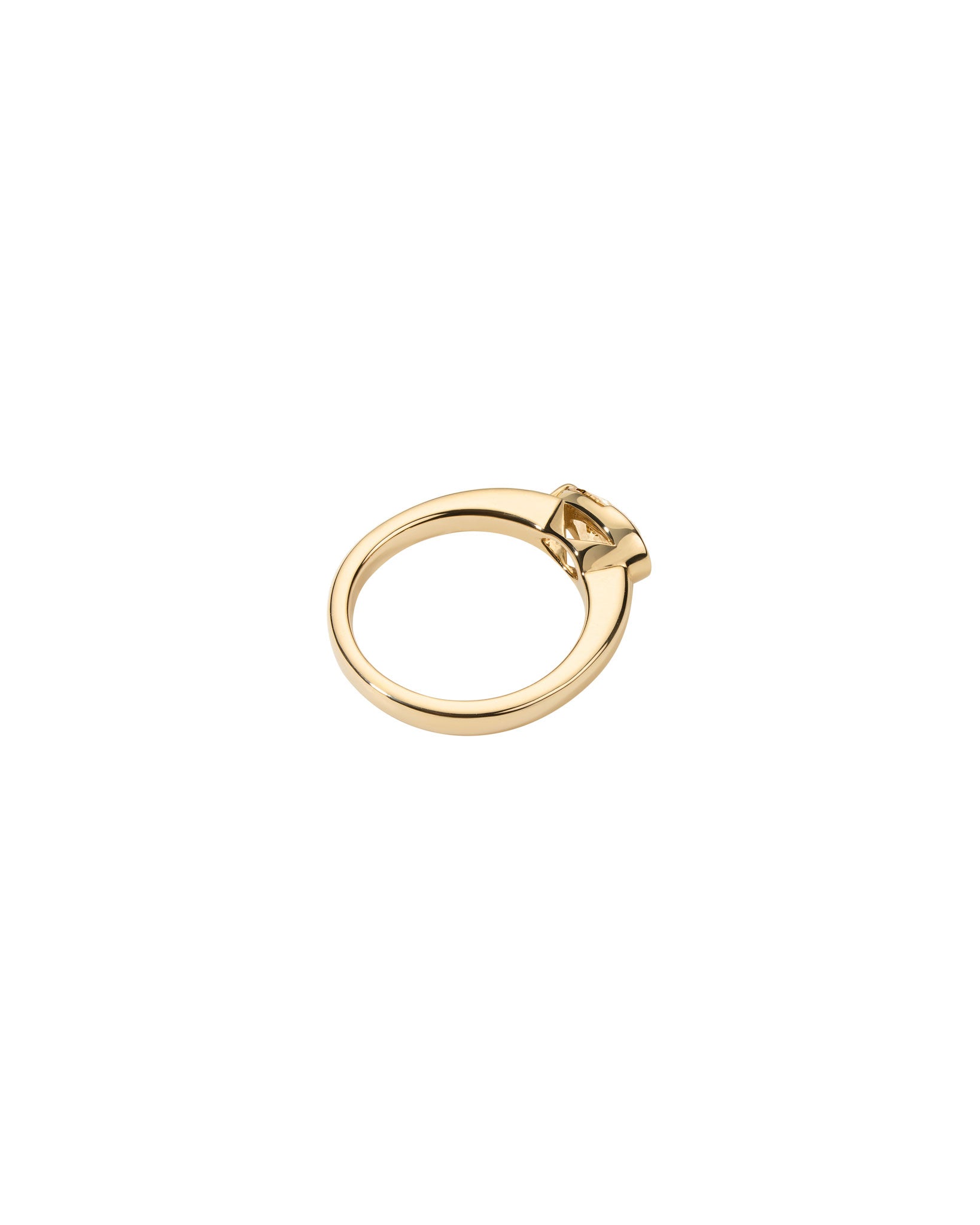 gold ring with a natural pear shaped diamond on a white background