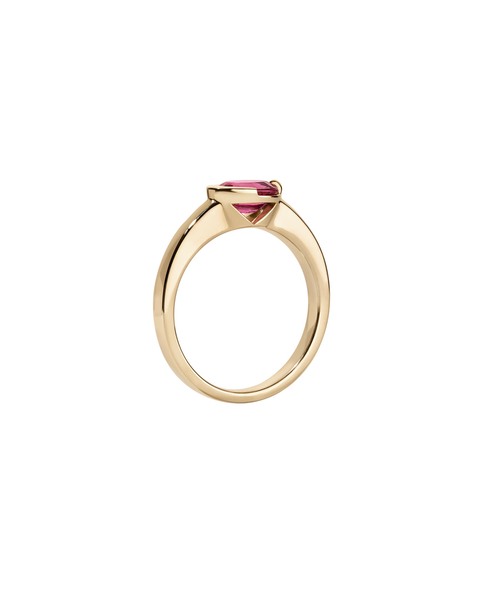 Gold ring with a pink gemstone on a white background