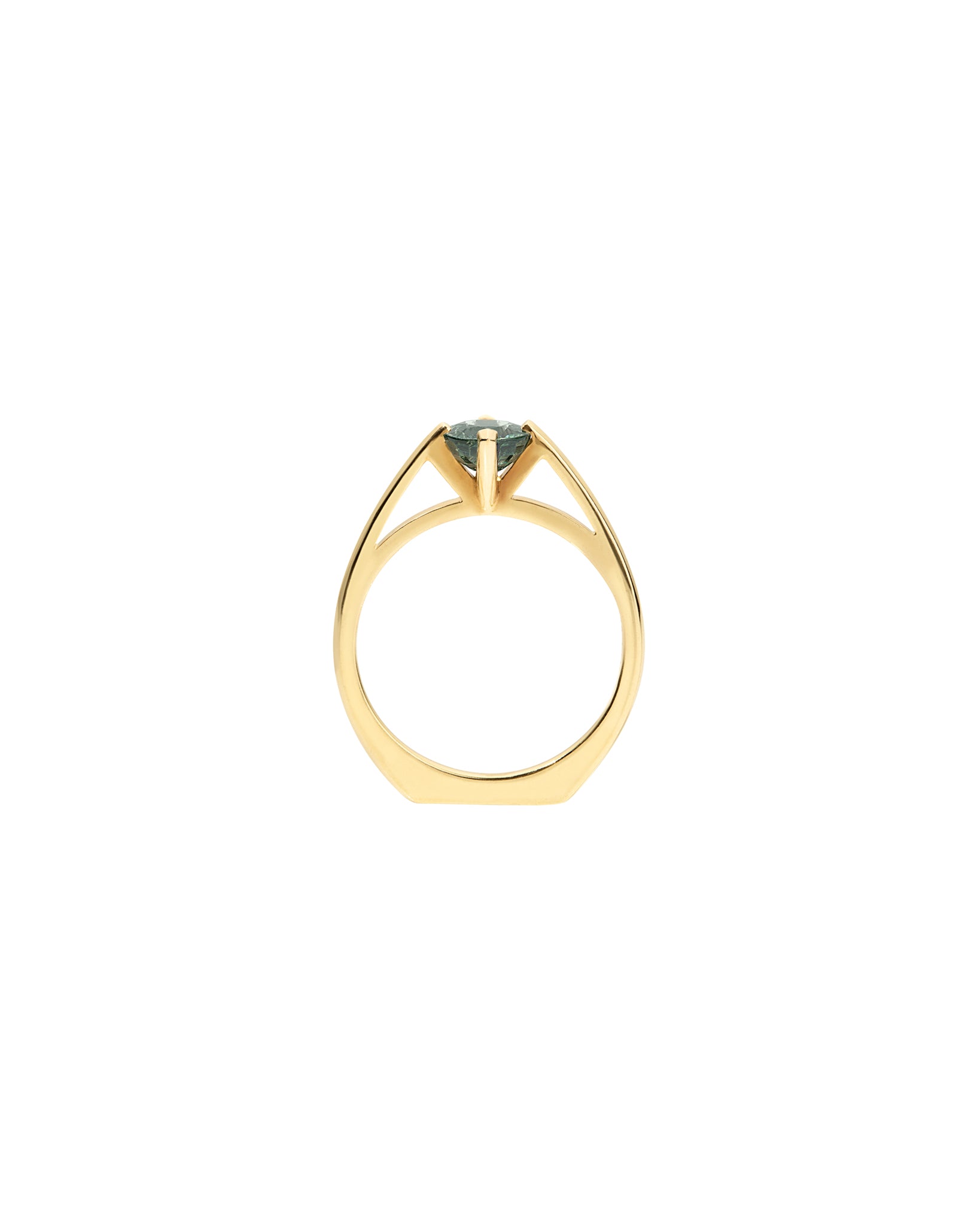 Gold ring with a green sapphire gemstone on a white background
