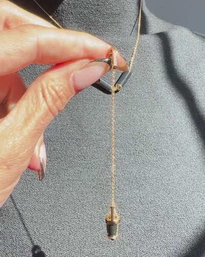 Showing how curio snaps onto bliss lau open necklace