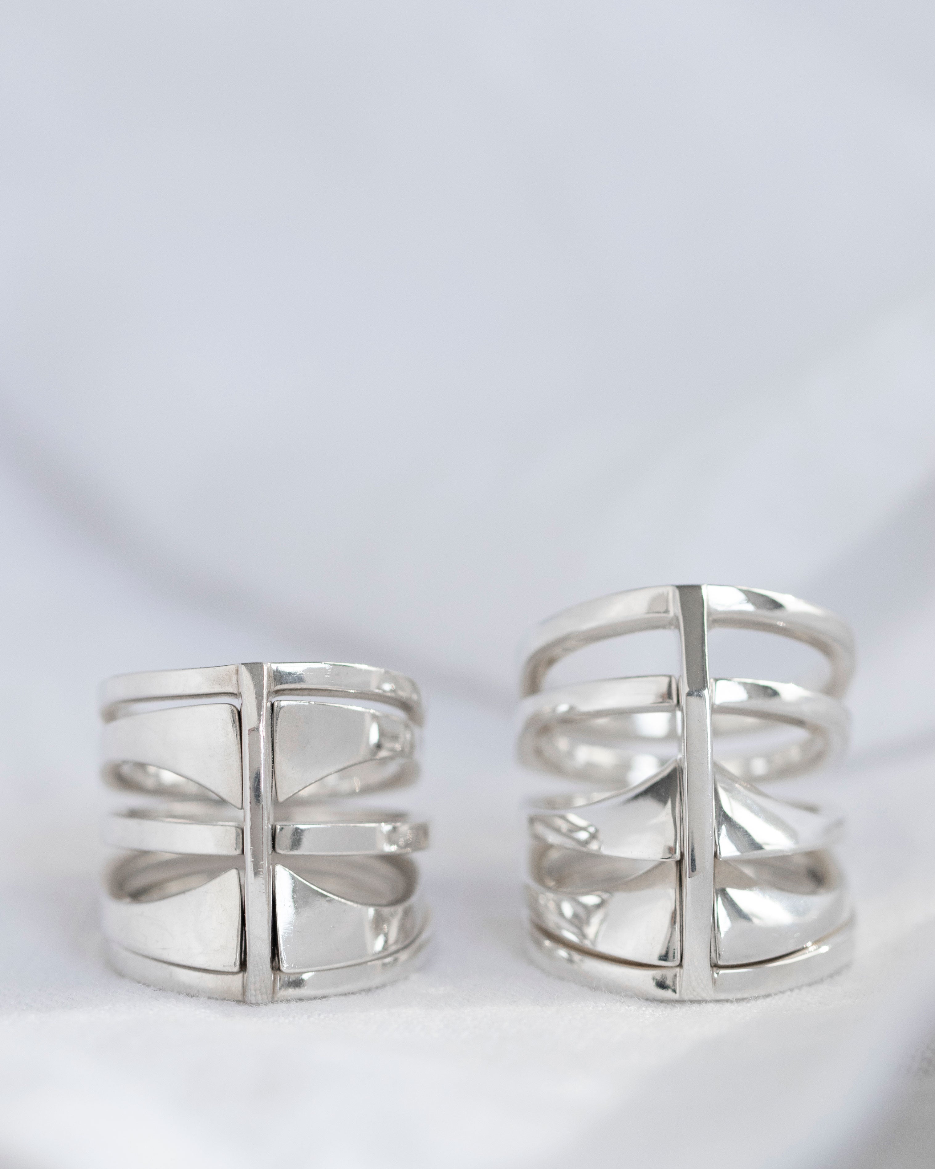 Close-up of the Kaleidoscope ring set, highlighting the details and craftsmanship of the sterling silver rings with an architectural design.