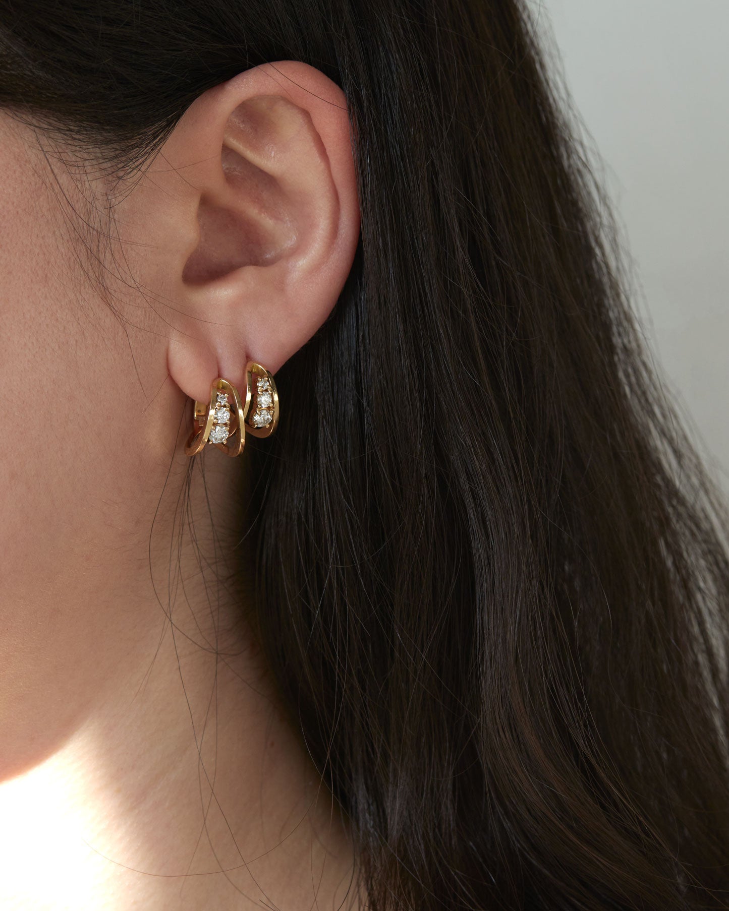 On body bliss lau empath earrings 18k gold and lab diamonds. 
