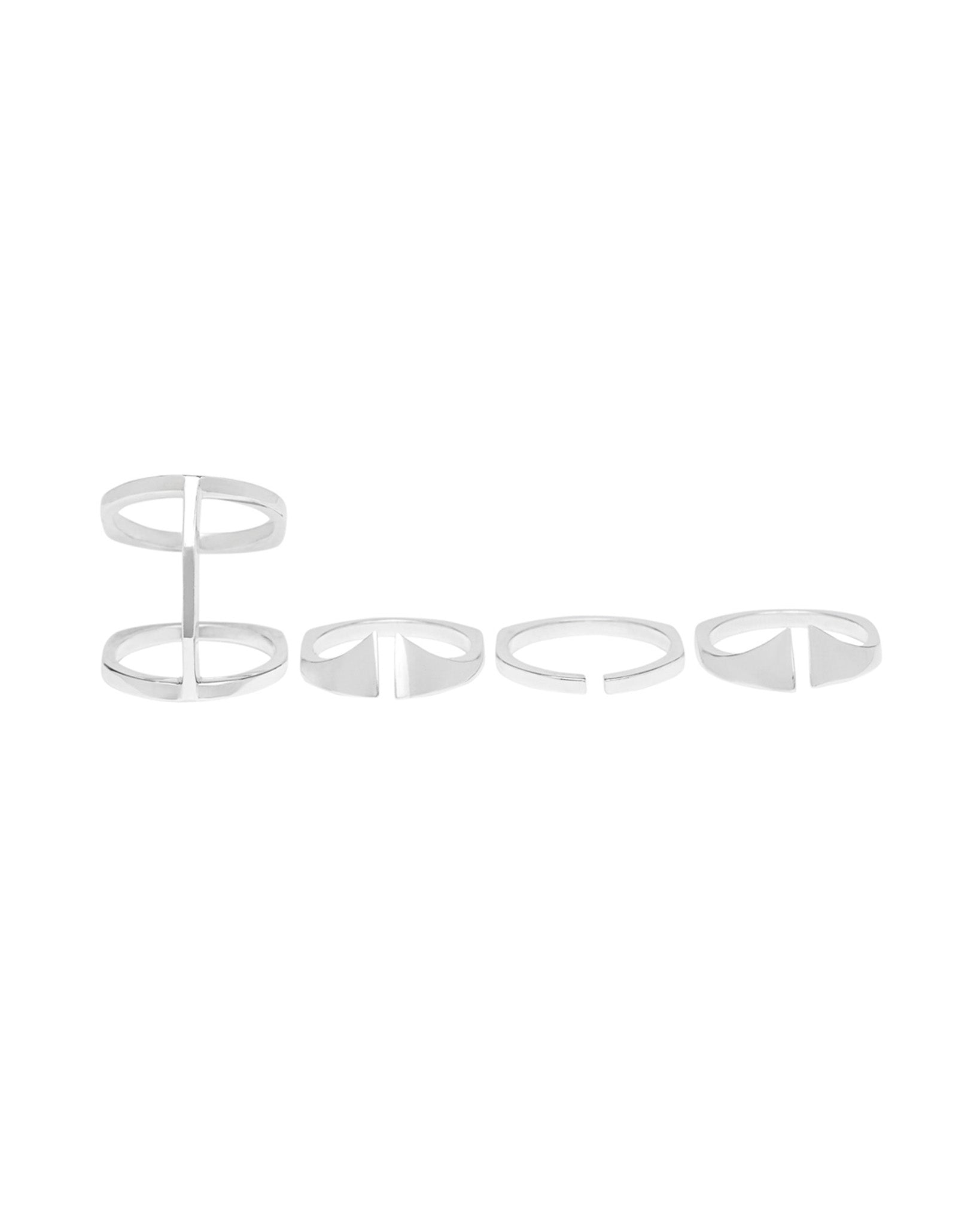 The Kaleidoscope ring set laid out flat, showcasing four rings including the central Bridge Ring and two Nuance Rings in a sleek sterling silver finish.