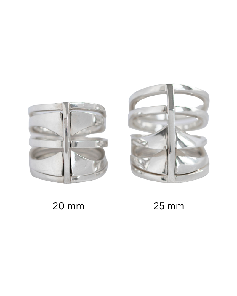 Two Kaleidoscope rings positioned next to each other against a soft background, displaying their unique shapes and polished texture.